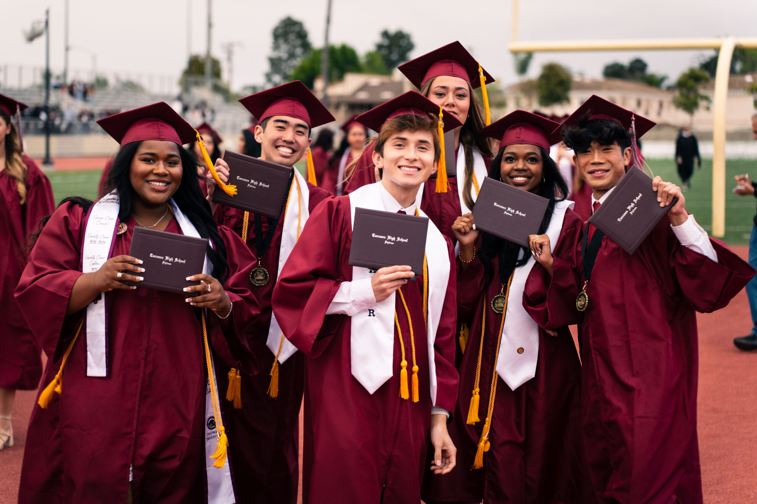 Graduates celebrating their high school diplomas