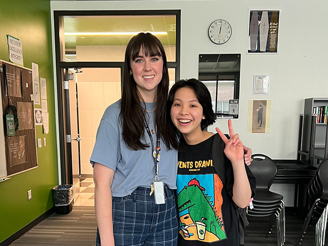 Educatius happy asian student with teacher